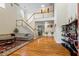 Elegant living room featuring hardwood floors, high ceilings, a staircase, and a comfortable sofa at 1140 Promontory Drive, Marietta, GA 30062