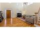 Bright living room with hardwood floors, a piano, and a comfortable sofa, and high ceilings at 1140 Promontory Drive, Marietta, GA 30062