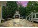 Inviting stone fireplace on the patio; perfect for enjoying cool evenings at 1140 Promontory Drive, Marietta, GA 30062