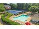 A community pool and tennis courts are featured in this aerial view of a neighborhood at 1140 Promontory Drive, Marietta, GA 30062