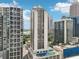 High-rise condominiums featuring tennis court, and pool for resident enjoyment, situated in a bustling area at 1280 W Peachtree Nw St # 2205, Atlanta, GA 30309