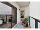 Relaxing balcony featuring outdoor seating, a plant, and an open view to the interior living space at 1280 W Peachtree Nw St # 2205, Atlanta, GA 30309