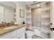 Well-lit bathroom features a granite vanity and shower with stylish curtain at 1280 W Peachtree Nw St # 2205, Atlanta, GA 30309