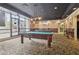 Well-lit billiard room with multiple tables, ornate decor, and city views at 1280 W Peachtree Nw St # 2205, Atlanta, GA 30309