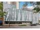 Modern office building featuring a striking glass facade with a forest motif in a bustling urban setting at 1280 W Peachtree Nw St # 2205, Atlanta, GA 30309