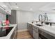 Bright, modern kitchen with stainless steel appliances, sleek cabinetry, and quartz countertops at 1280 W Peachtree Nw St # 2205, Atlanta, GA 30309