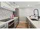 Contemporary kitchen featuring stainless steel appliances, white cabinets, and sleek hardware at 1280 W Peachtree Nw St # 2205, Atlanta, GA 30309