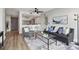 Inviting living room with modern decor, luxury flooring, and an open layout to the kitchen at 1280 W Peachtree Nw St # 2205, Atlanta, GA 30309