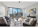 Bright living room featuring floor-to-ceiling windows with skyline views at 1280 W Peachtree Nw St # 2205, Atlanta, GA 30309