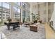 Stunning lobby with expansive windows, stylish furnishings, and a grand piano at 1280 W Peachtree Nw St # 2205, Atlanta, GA 30309
