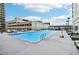 Enjoy the sunshine on this outdoor pool deck with lounge chairs and city views at 1280 W Peachtree Nw St # 2205, Atlanta, GA 30309