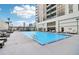 Stunning rooftop pool with lounge chairs offering an urban oasis with a scenic backdrop at 1280 W Peachtree Nw St # 2205, Atlanta, GA 30309