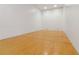 Well-maintained racquetball court featuring white walls and a finished wood floor at 1280 W Peachtree Nw St # 2205, Atlanta, GA 30309