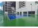 Well-maintained outdoor tennis court with green and blue surface, surrounded by high-rise buildings at 1280 W Peachtree Nw St # 2205, Atlanta, GA 30309