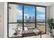 Striking city views from large windows illuminate a comfortable nook at 1280 W Peachtree Nw St # 2205, Atlanta, GA 30309