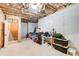 Unfinished basement with exposed ceiling and concrete walls, offering potential at 13067 Overlook Pass, Roswell, GA 30075