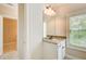Bathroom vanity with granite countertops and a window at 13067 Overlook Pass, Roswell, GA 30075