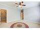 Airy bedroom with a walk-in closet, ceiling fan, carpet, and natural light at 13067 Overlook Pass, Roswell, GA 30075