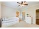 Comfortable bedroom featuring a daybed, a dresser, and natural light, creating a cozy and inviting atmosphere at 13067 Overlook Pass, Roswell, GA 30075