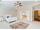 Bedroom with a ceiling fan, area rug and ensuite bathroom at 13067 Overlook Pass, Roswell, GA 30075
