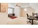 Versatile bonus room features carpet flooring, an office setup, and ample space for various activities at 13067 Overlook Pass, Roswell, GA 30075