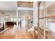 Grand foyer with hardwood floors, a staircase, and views into the living room, creating an inviting entrance at 13067 Overlook Pass, Roswell, GA 30075