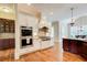 Gourmet kitchen showcases stainless steel appliances, custom cabinetry, and granite countertops at 13067 Overlook Pass, Roswell, GA 30075