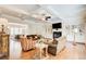 Spacious living room boasts hardwood floors, coffered ceilings, fireplace, and built-in shelving at 13067 Overlook Pass, Roswell, GA 30075