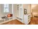 Mudroom with built-in bench, storage cubbies, and hardwood flooring at 13067 Overlook Pass, Roswell, GA 30075