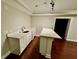 Basement featuring a counter with white cabinets and dark hardwood floors at 2822 Salem Oak Way, Duluth, GA 30096