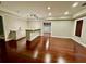 Spacious basement with hardwood floors, tray ceiling, and bar area at 2822 Salem Oak Way, Duluth, GA 30096