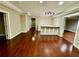 Open basement space with hardwood floors, tray ceiling, and bar area at 2822 Salem Oak Way, Duluth, GA 30096