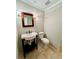 Powder room with a vanity sink and decorative mirror at 2822 Salem Oak Way, Duluth, GA 30096