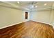 Bedroom featuring wood floors, a window and decorative trey ceiling at 2822 Salem Oak Way, Duluth, GA 30096