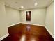 A cozy bedroom with hardwood floors and a window at 2822 Salem Oak Way, Duluth, GA 30096