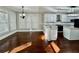 Bright kitchen and eat in area offer island with light countertops and ample seating space at 2822 Salem Oak Way, Duluth, GA 30096