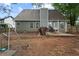 Home's backyard shows a patio and fencing at 565 Saint James Ct, Lawrenceville, GA 30044