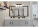Bright bathroom showcases a double vanity with modern lighting and fixtures at 565 Saint James Ct, Lawrenceville, GA 30044