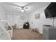 Well-lit bedroom with neutral carpet and a cozy play area at 565 Saint James Ct, Lawrenceville, GA 30044