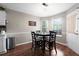 Charming dining area with a round table, four chairs, and a 