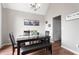 Elegant dining room featuring hardwood floors, a neutral color palette, and a dining set at 565 Saint James Ct, Lawrenceville, GA 30044