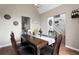 Open dining room with hardwood floors, decor, views to the entry foyer, and an airy atmosphere at 565 Saint James Ct, Lawrenceville, GA 30044