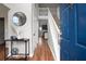 Inviting foyer with hardwood floors, staircase, and an open view to the living area at 565 Saint James Ct, Lawrenceville, GA 30044