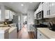 Modern kitchen featuring stainless steel appliances, ample counter space, and an open layout at 565 Saint James Ct, Lawrenceville, GA 30044