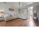 Cozy living room with a large sectional sofa and staircase access to the second floor at 565 Saint James Ct, Lawrenceville, GA 30044