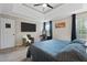 Inviting main bedroom with a tray ceiling, a comfy bed, and natural light from the window at 565 Saint James Ct, Lawrenceville, GA 30044