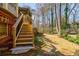 The backyard features a deck with stairs leading to the spacious, landscaped yard at 656 Gunby Se Rd, Marietta, GA 30067