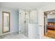 Bathroom featuring glass-enclosed shower with marble surround, tiled floors, and a decorative mirror at 656 Gunby Se Rd, Marietta, GA 30067