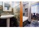 Modern bathroom featuring textured walls, a vanity, and a shower tub at 656 Gunby Se Rd, Marietta, GA 30067