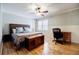 Spacious bedroom with hardwood floors, ceiling fan, and natural light at 656 Gunby Se Rd, Marietta, GA 30067